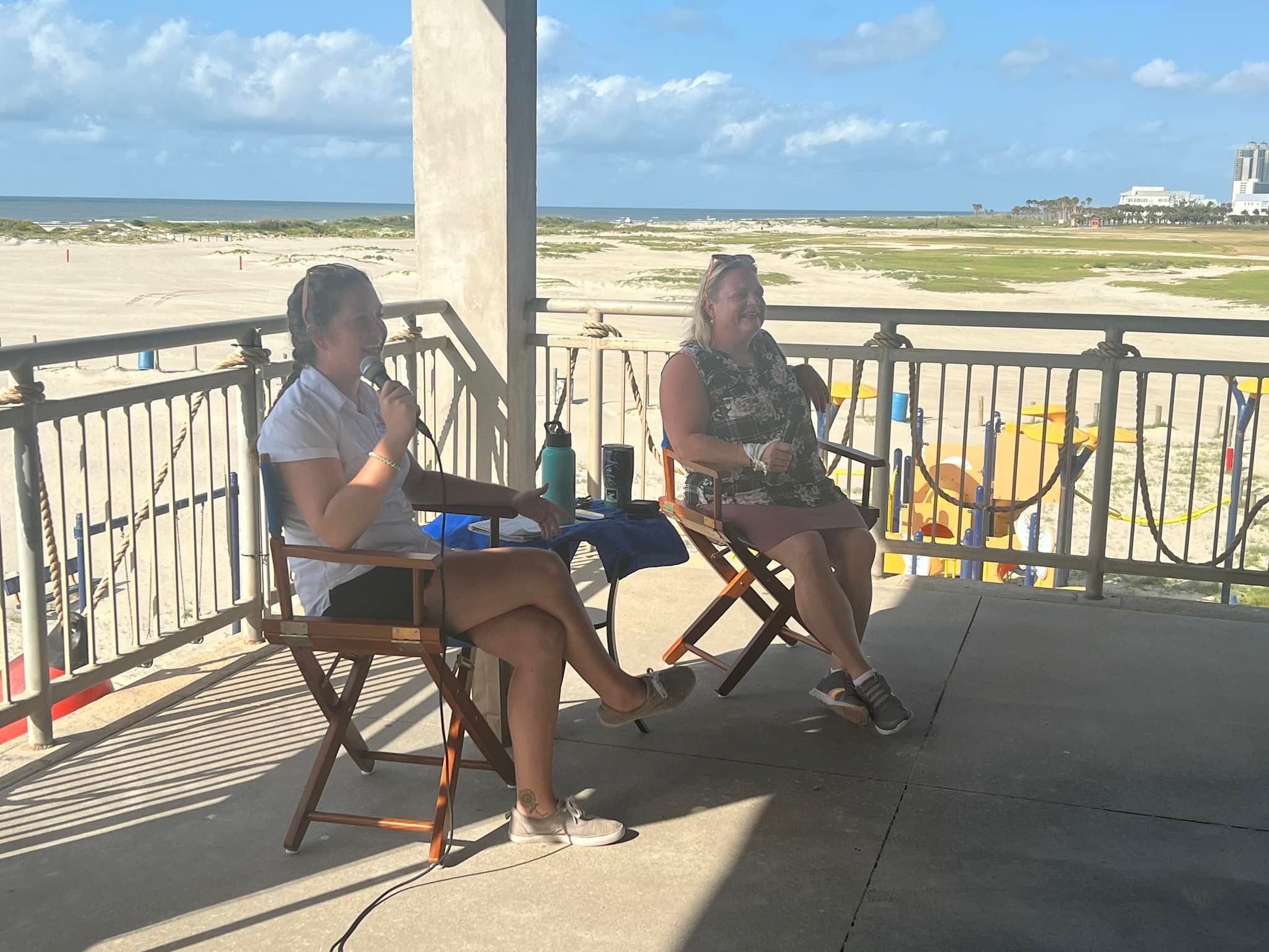 Two ladies sitting in the East Beach Pavilion