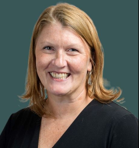 Professional headshot of young lady with blonde hair